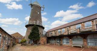 Georgian-era windmill with luxury flats goes on sale for £695k