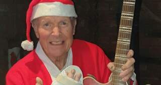 Musician has own Christmas song played during emergency operation – and he even sang along