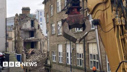 Demolition of collapsed building at 'halfway stage'