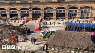 Woman hit by bus outside railway station