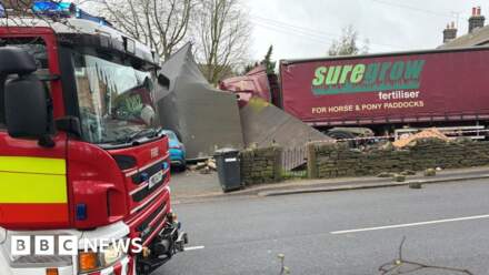 Lorry demolishes garage after crashing into cars