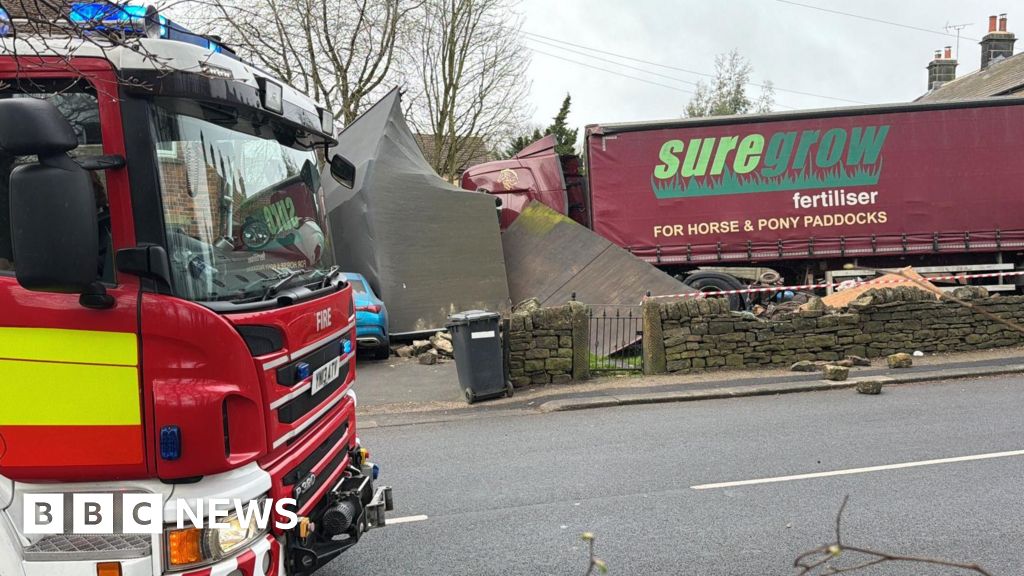 Lorry demolishes garage after crashing into cars
