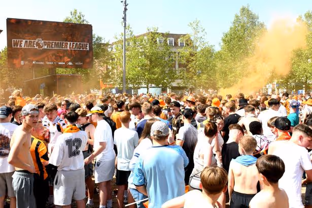 Golden day for a black-and-amber party as Hull City fans celebrate promotion – in pictures