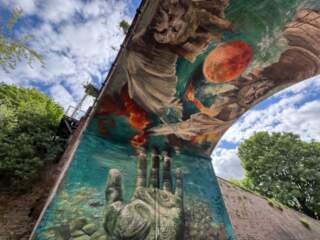 International artist designs striking new mural for city centre park