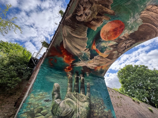 International artist designs striking new mural for city centre park