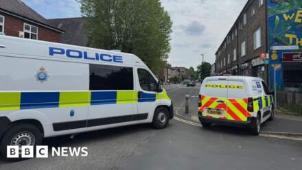 Man arrested after 'unexplained' death in street