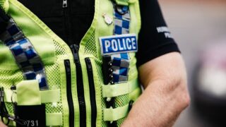 Man arrested after pensioner in his 70s is injured in suspected robbery